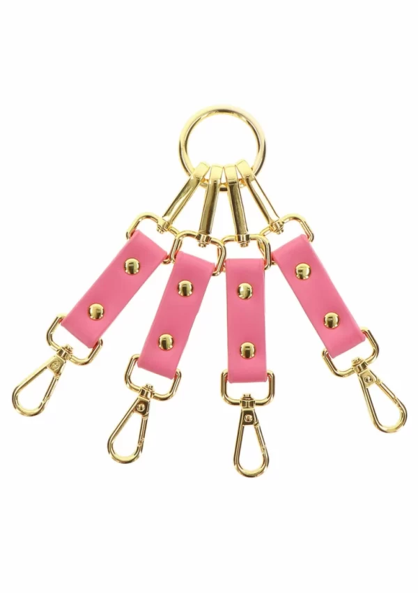 <strong>Taboom Malibu Hogtie Pink Vegan Leather Gold Details Restraint System</strong><br><br>Discover a new level of sophistication and control with the Taboom Malibu Hogtie. Crafted from premium pink vegan PU leather and finished with elegant gold-plated metal hardware