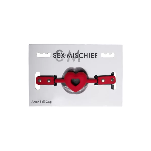 Sportsheets Sex & Mischief Serce Red - Pasek intymny z otworami